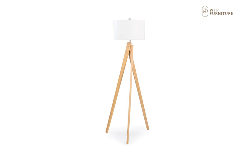 Minimalist tripod floor lamp with a white lampshade.